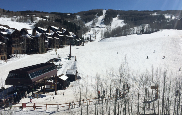 a ski resort with buildings and snow