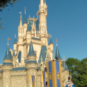 a castle with blue and yellow flags