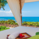 a white canopy with a tray of towels and a towel on it