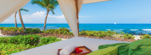 a white canopy with a tray of towels and a towel on it