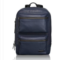 a blue backpack with zippers