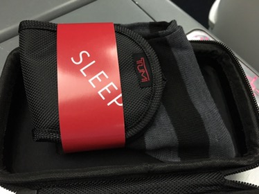 a black and red bag with a red label
