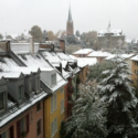 a snow covered rooftops of a town