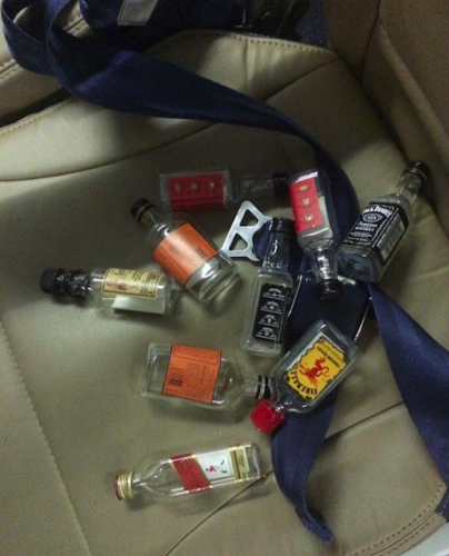 a group of small bottles on a seat