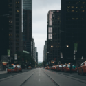 a street with cars and buildings