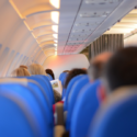 a group of people sitting in an airplane