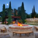 a fire pit with benches around it