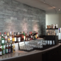 a bar with many bottles and glasses