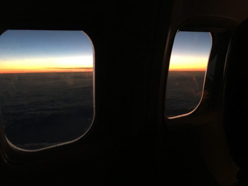 a view of the sunset from a plane window