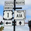 a street sign with a green light