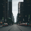 a street with cars parked in front of buildings