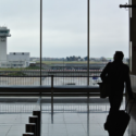 a man with luggage in an airport