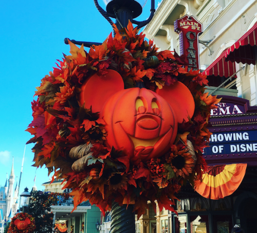 a pumpkin wreath on a pole
