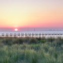 a sunset over a body of water