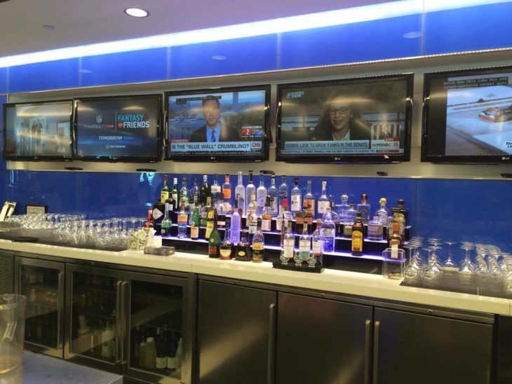 a bar with several bottles and glasses