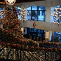 a large staircase with lights and a christmas tree