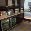 a fridge with drinks and glasses on it