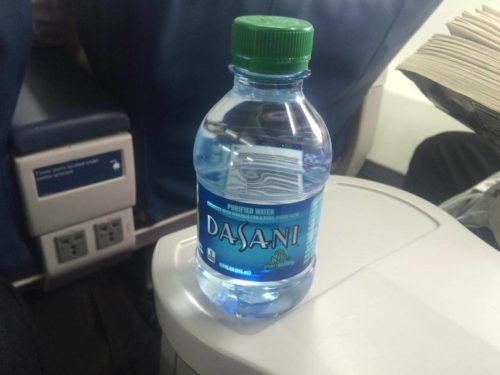 a bottle of water on a white surface