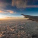 an airplane wing above clouds