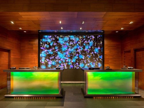 a reception desks with colorful lights
