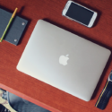 a laptop and cellphone on a table