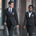 a man and woman in suits walking