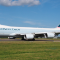 a large white airplane on a runway