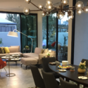 a living room with a chandelier and couches