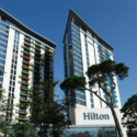 a tall building with trees in front of it