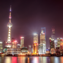 a city skyline with lights at night