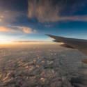 an airplane wing above the clouds