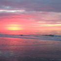 a sunset over a beach