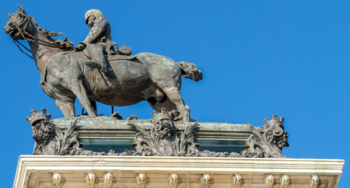 a statue of a man riding a horse