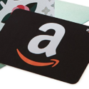 a black gift card with a white letter on it