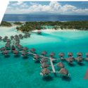 a group of huts on water