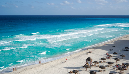 a beach with umbrellas and umbrellas