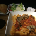 a plate of pasta and salad