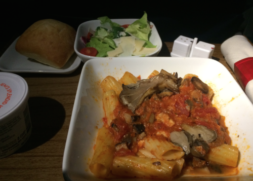 a plate of pasta and salad