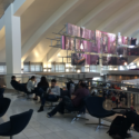 people sitting in chairs in a building