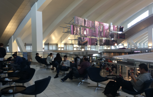 people sitting in chairs in a building