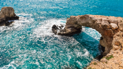 a rock bridge over a body of water