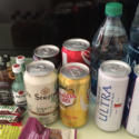 a group of cans and bottles of food