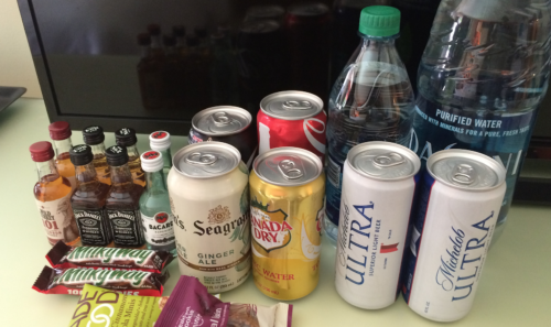 a group of cans and bottles of food