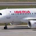 a white airplane on a runway