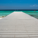 a dock leading to the ocean