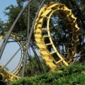 a roller coaster with a couple of yellow rails