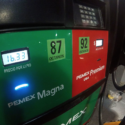 a green and red gas pump