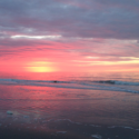 a sunset over a beach