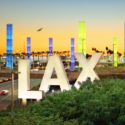 a large sign with a city in the background