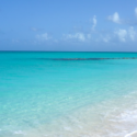 a blue water and white sand